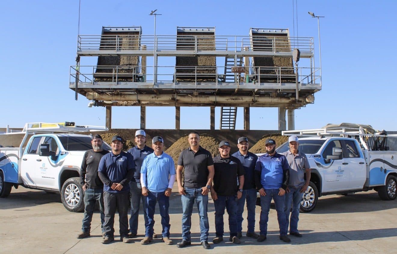 XDS crew and fleet trucks at a dairy separator job site