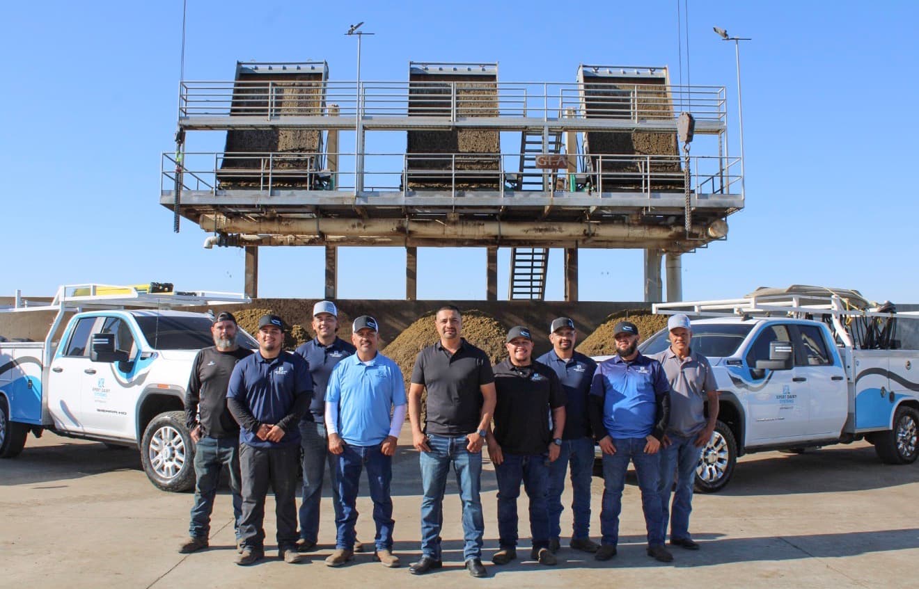 XDS crew and fleet trucks at a dairy separator job site