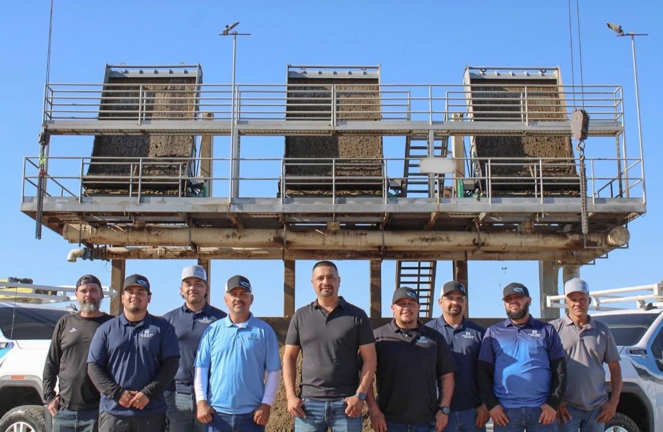 The full XDS technician crew in front of a GEA dairy manure separator platform